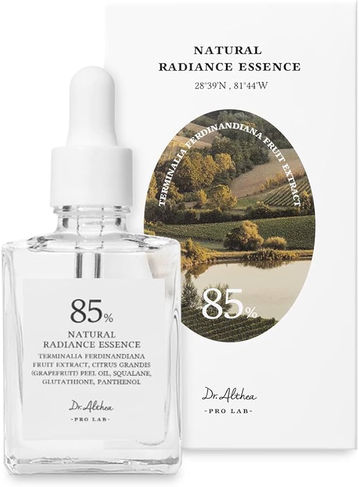 Clear bottle of 85% Natural Radiance Essence with dropper and scenic label on white background