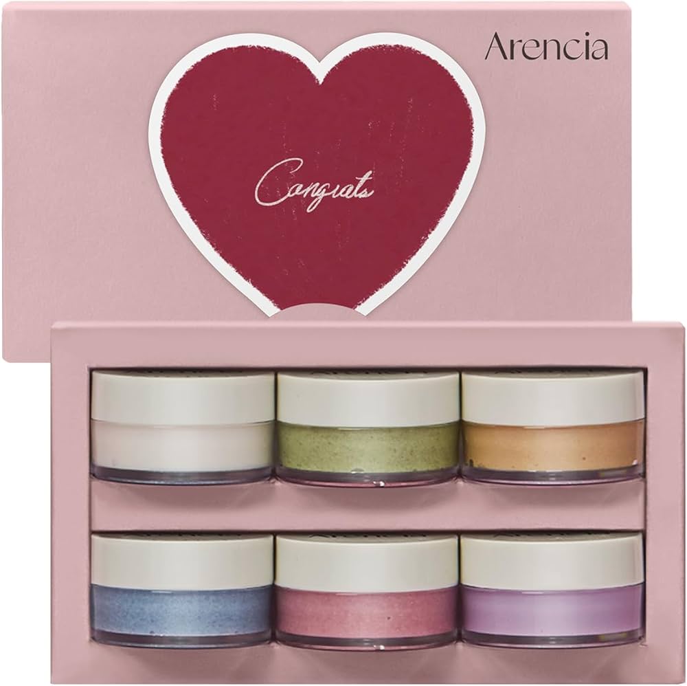 Set of six small jars with different colors in a pink box with a heart-shaped window, featuring the brand 'Arenicia'.