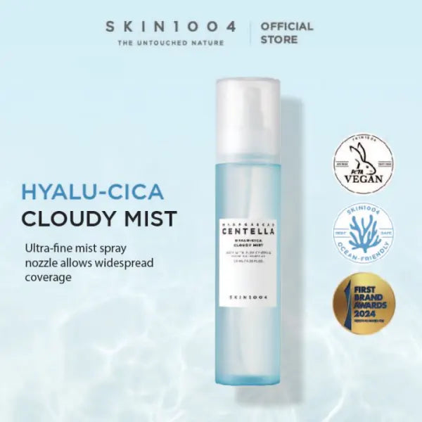 SKIN1004 Hyalu-Cica Cloudy Mist bottle on a light blue background with brand logos.