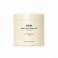 A cream-colored cosmetic jar of Abib Jericho rose collagen pad on a clean white background.