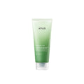Green skincare tube labeled 'anua' on a white background