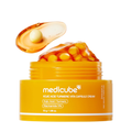 Yellow jar of Medicube cream with capsules on a white background