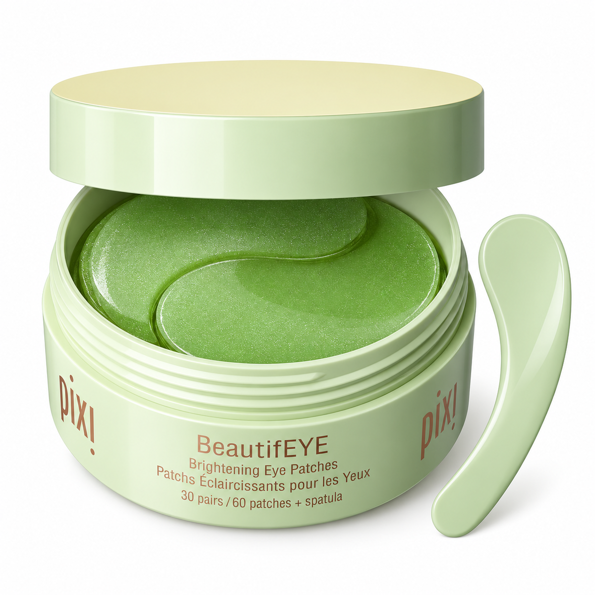 Pixi BeautifEYE Brightening Eye Patches in a light green jar with an open lid, showing the green eye patches inside, and a matching spatula on a white background.