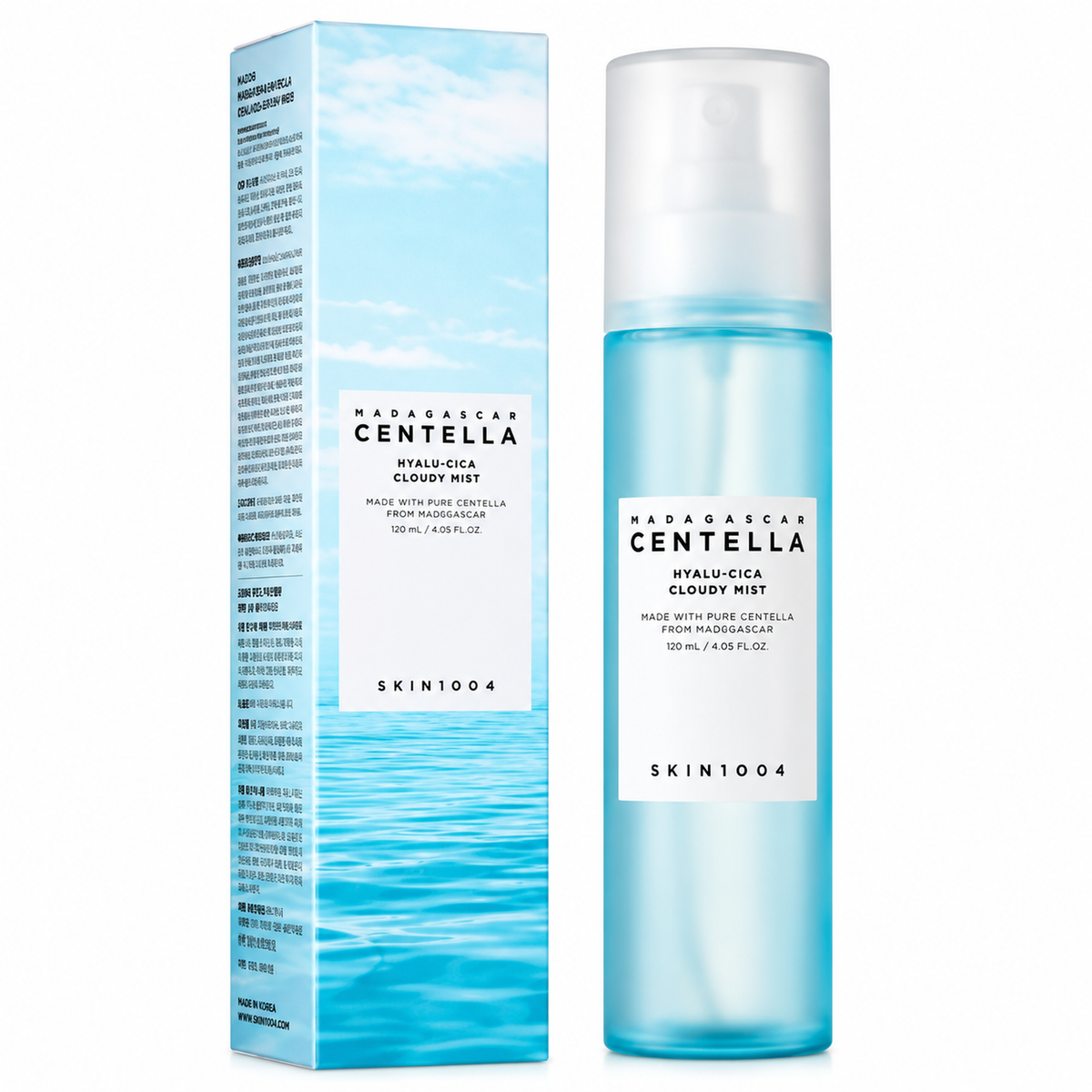 A skincare product shown as a tall translucent blue bottle next to its matching retail box. The packaging features a sky and ocean design in shades of blue and white, with black text reading 'MADAGASCAR CENTELLA' and 'SKIN1004'.