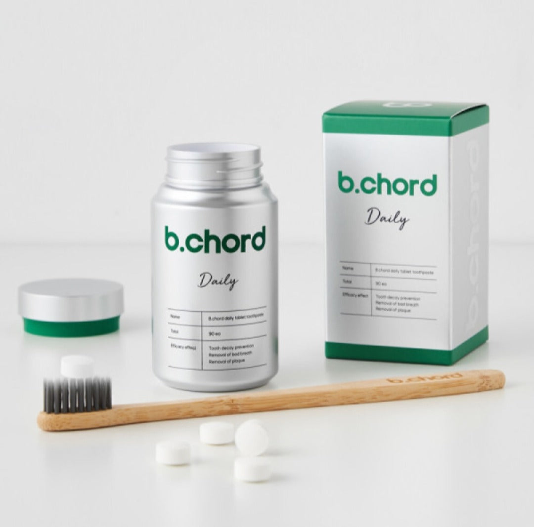 b.chord product with packaging, brush, and capsules on a white background