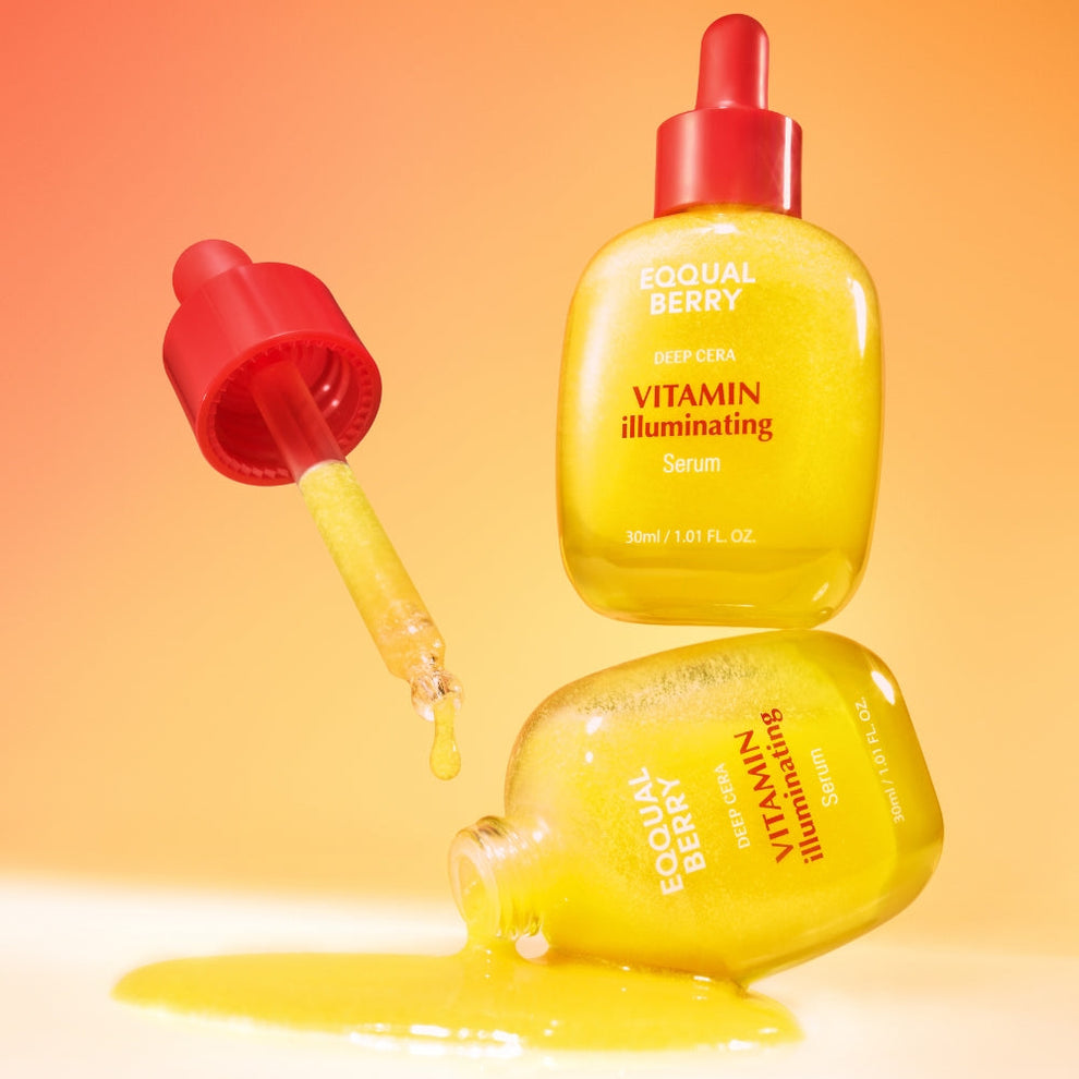 Yellow serum bottle with red cap on an orange gradient background