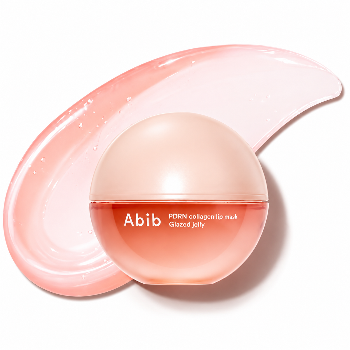 Abib PDRN collagen lip mask in a round translucent peach jar, shown with a glossy pink smear of the glazed jelly behind it on a white background.