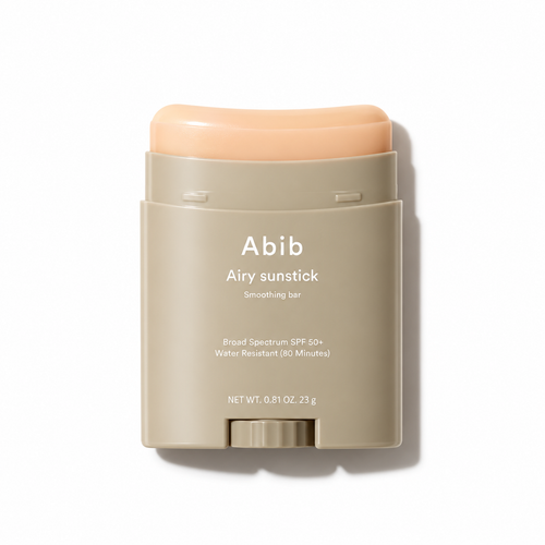 Abib Airy sunstick smoothing bar in a matte beige stick container with a peach-colored product stick visible at the top, shown on a clean white background.
