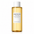 A 400 mL clear bottle of SKIN1004 Madagascar Centella Toning Toner filled with golden-yellow liquid, featuring a white cap and a white label with black text, set against a plain white background.