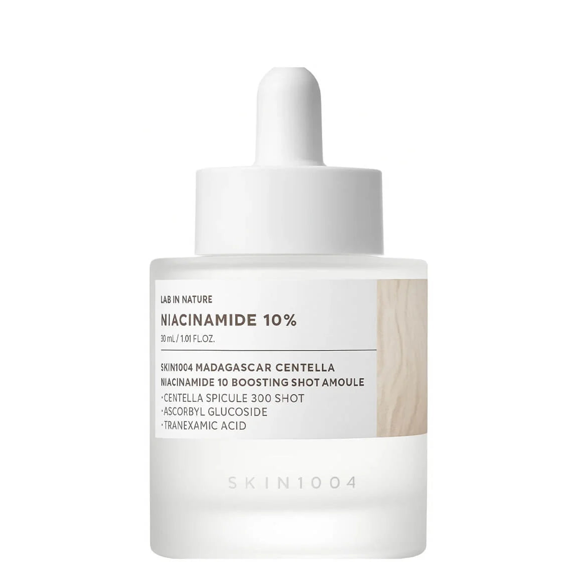 Skincare dropper bottle with 'Niacinamide 10%' label on a white background